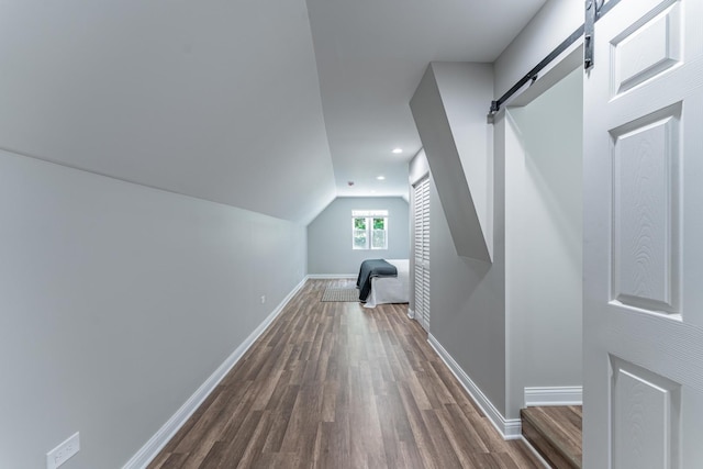 4438 S Knox Ave, Chicago, IL 60632 - additional living space featuring a barn door, dark wood-style flooring, and lofted ceiling