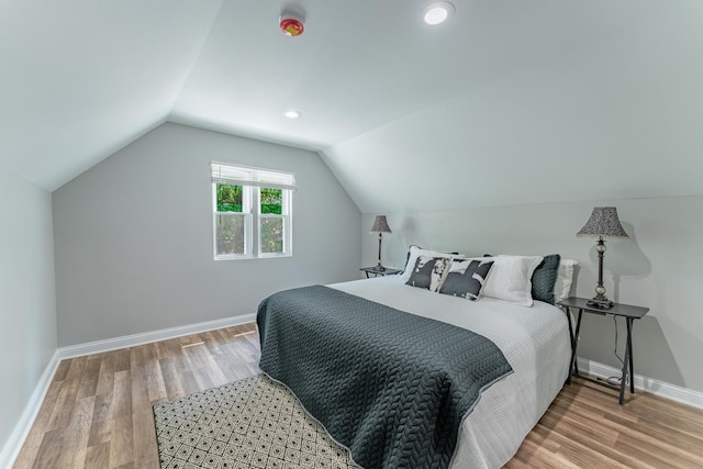 4438 S Knox Ave, Chicago, IL 60632 - bedroom with wood finished floors, vaulted ceiling, and recessed lighting
