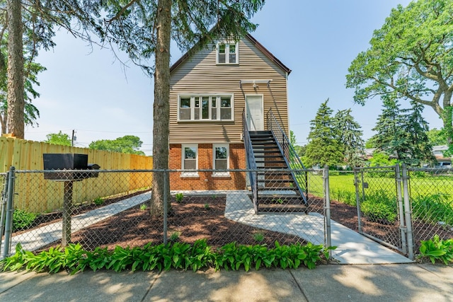 4438 S Knox Ave, Chicago, IL 60632 - view of front of house featuring a gate, brick siding, and stairway
