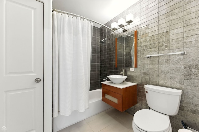 2314 N Mango Ave, Chicago, IL 60639 - bathroom with shower / bath combo, tile walls, vanity, and tile patterned flooring