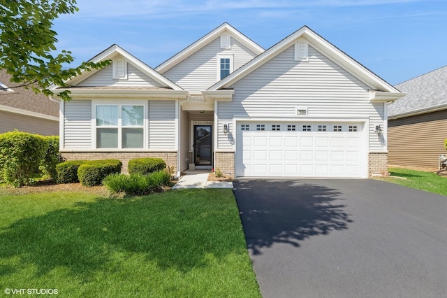 1029 Carolina Ct, Pingree Grove, IL 60140 - view of front of house featuring brick siding, asphalt driveway, an attached garage, and a front lawn