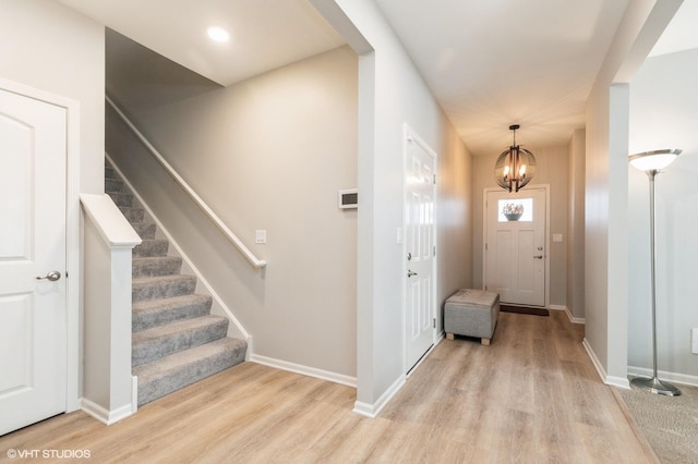1029 Carolina Ct, Pingree Grove, IL 60140 - entrance foyer featuring a chandelier, light wood-style floors, and stairway