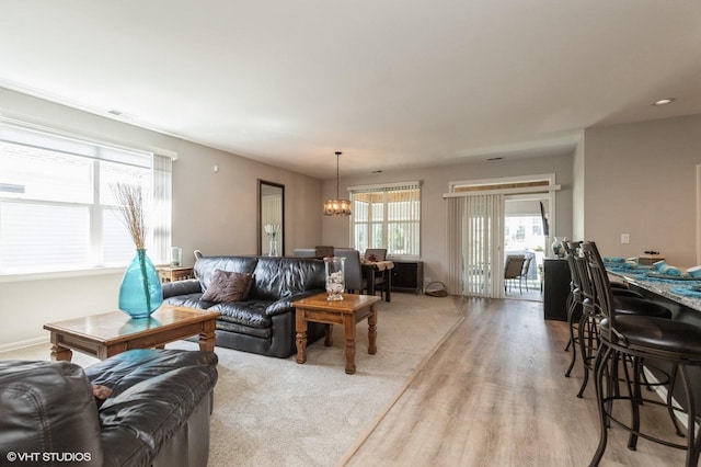 1029 Carolina Ct, Pingree Grove, IL 60140 - living area featuring a chandelier and light wood-type flooring