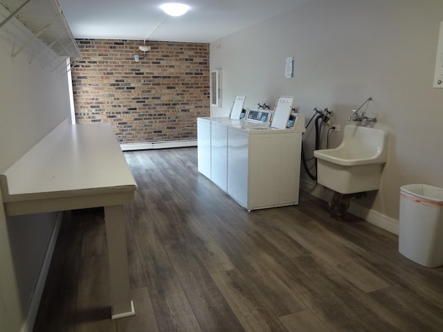 1931 Prairie Sq Unit 329, Schaumburg, IL 60173 - laundry room with separate washer and dryer, dark wood finished floors, and brick wall