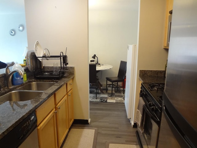 1931 Prairie Sq Unit 329, Schaumburg, IL 60173 - kitchen featuring appliances with stainless steel finishes, dark wood-style flooring, and dark stone counters