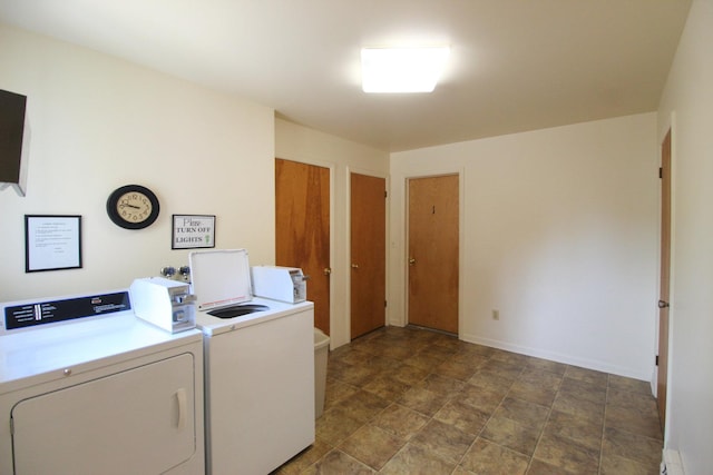 420 W N St, Bradley, IL 60915 - community laundry featuring a baseboard radiator, washing machine and clothes dryer, and stone finish flooring