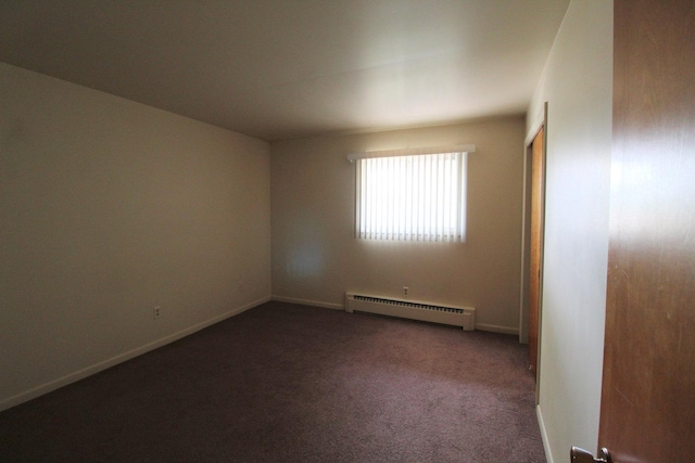 420 W N St, Bradley, IL 60915 - carpeted empty room featuring a baseboard heating unit and baseboards