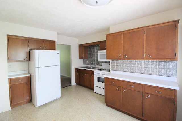 420 W N St, Bradley, IL 60915 - kitchen featuring white appliances, decorative backsplash, light countertops, and brown cabinets
