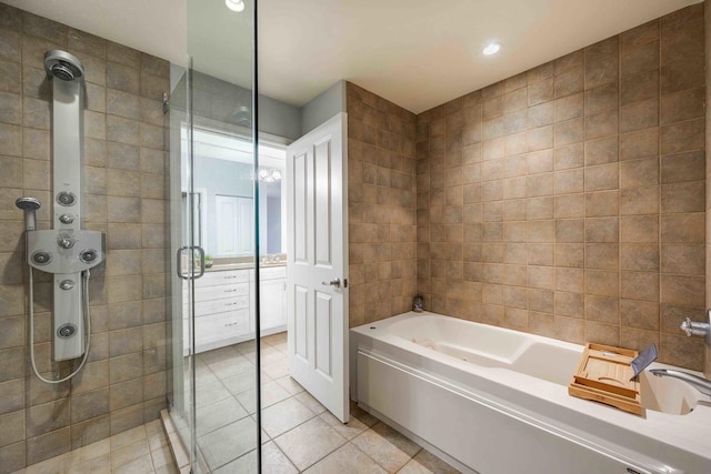 1250 S Michigan Ave Unit 2802, Chicago, IL 60605 - full bathroom with a stall shower, a garden tub, tile patterned flooring, tile walls, and recessed lighting