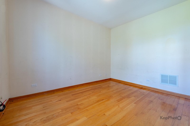 4137 S Prairie Ave Unit 3, Chicago, IL 60653 - empty room with light wood-style flooring and baseboards