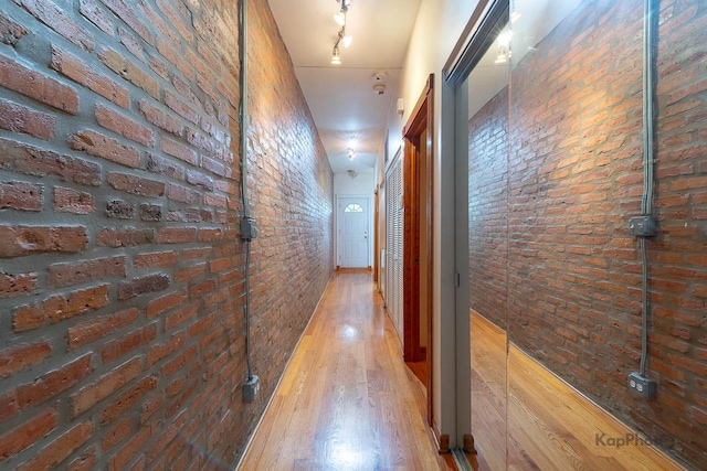 4137 S Prairie Ave Unit 3, Chicago, IL 60653 - hall with brick wall and wood finished floors