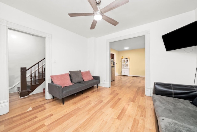 422 Locust St, Elgin, IL 60123 - sitting room featuring light wood finished floors, ceiling fan, and stairs