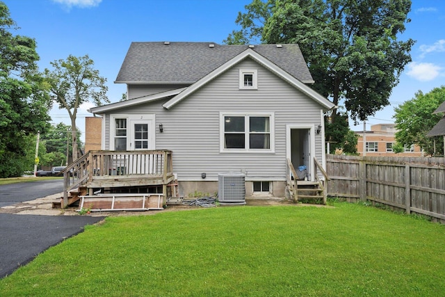 422 Locust St, Elgin, IL 60123 - rear view of house with entry steps, roof with shingles, and a wooden deck