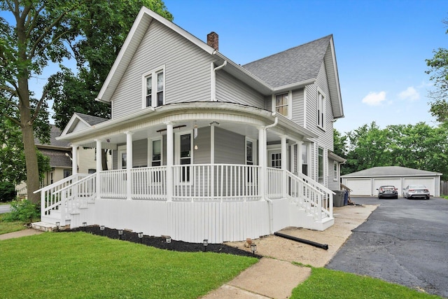 422 Locust St, Elgin, IL 60123 - view of front of property featuring a porch, an outbuilding, a chimney, a detached garage, and roof with shingles