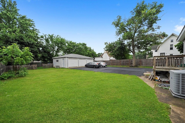 422 Locust St, Elgin, IL 60123 - fenced backyard with a detached garage and an outbuilding