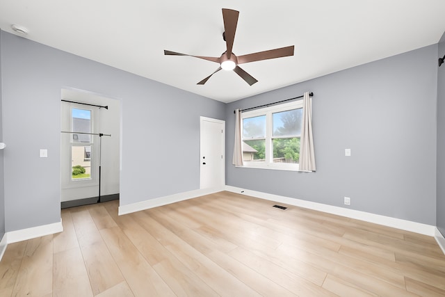 422 Locust St, Elgin, IL 60123 - spare room with ceiling fan, a smoke detector, and light wood finished floors