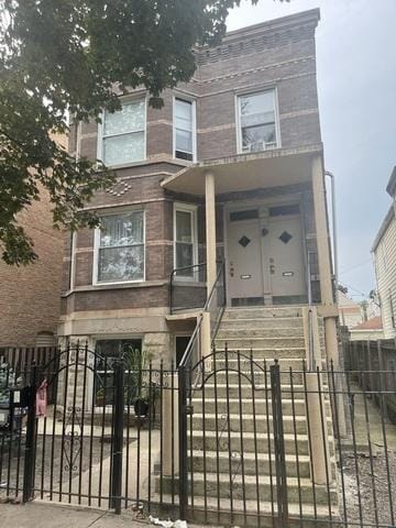 1926 N Keystone Ave, Chicago, IL 60639 - view of front of home with a fenced front yard, stairs, a gate, and covered porch