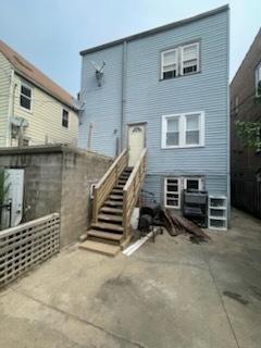 1926 N Keystone Ave, Chicago, IL 60639 - rear view of house with a patio area