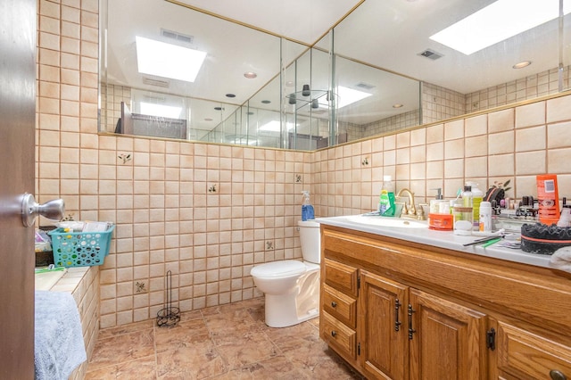 1717 Oak Lane Rd, Flossmoor, IL 60422 - full bath featuring tile walls, vanity, a skylight, decorative backsplash, and a shower with shower door