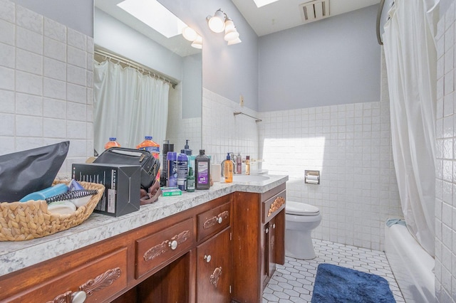 1717 Oak Lane Rd, Flossmoor, IL 60422 - bathroom with tile walls, a skylight, vanity, tile patterned floors, and shower / bath combination with curtain