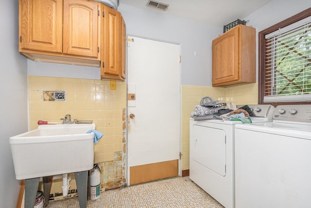 1717 Oak Lane Rd, Flossmoor, IL 60422 - washroom with separate washer and dryer, cabinet space, and tile walls