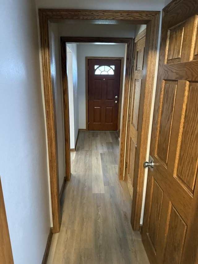 602 River Ln, Loves Park, IL 61111 - hallway featuring light wood-type flooring and baseboards
