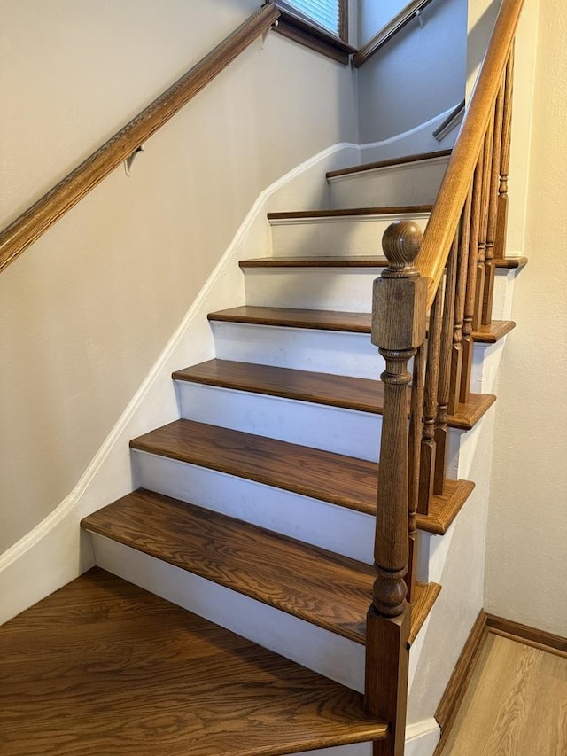 602 River Ln, Loves Park, IL 61111 - staircase with wood finished floors and baseboards