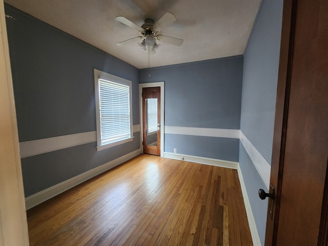 661 S Swain Ave, Elmhurst, IL 60126 - unfurnished room with wood finished floors and a ceiling fan