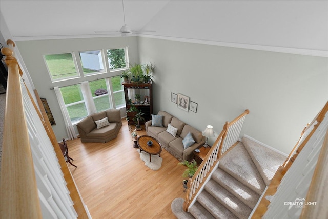 25 Cedar Ct, South Elgin, IL 60177 - living area featuring crown molding, wood finished floors, stairway, a towering ceiling, and ceiling fan