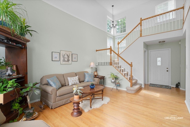 25 Cedar Ct, South Elgin, IL 60177 - living area with stairway, wood finished floors, and a towering ceiling