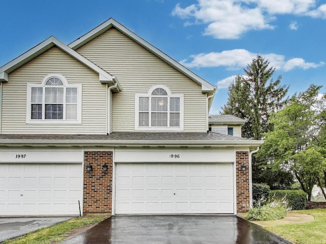 1996 Blackberry Ln, Hoffman Estates, IL 60169 - view of front of house featuring brick siding, asphalt driveway, and an attached garage