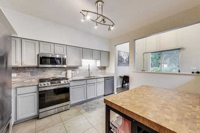 1996 Blackberry Ln, Hoffman Estates, IL 60169 - kitchen with stainless steel appliances, gray cabinets, decorative backsplash, and light tile patterned flooring