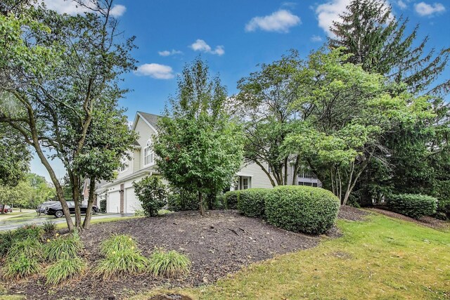1996 Blackberry Ln, Hoffman Estates, IL 60169 - view of side of home with an attached garage and concrete driveway