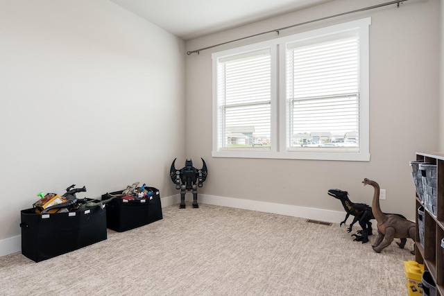 650 Anacostia Dr, Roscoe, IL 61073 - rec room with carpet and baseboards
