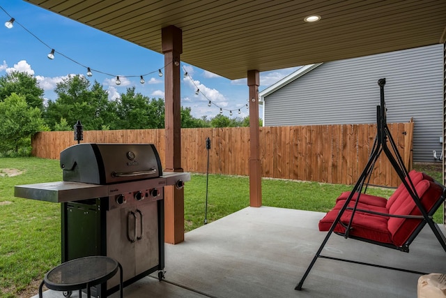 650 Anacostia Dr, Roscoe, IL 61073 - fenced backyard with a grill and a patio
