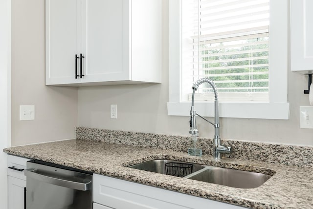650 Anacostia Dr, Roscoe, IL 61073 - kitchen with dishwasher, white cabinetry, and light stone countertops