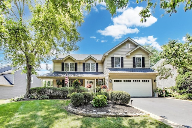 346 Colonial Cir, Geneva, IL 60134 - view of front of house featuring concrete driveway, a garage, and a front lawn