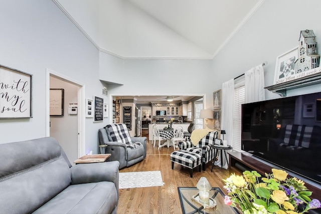 346 Colonial Cir, Geneva, IL 60134 - living area with crown molding, high vaulted ceiling, wood finished floors, and ceiling fan