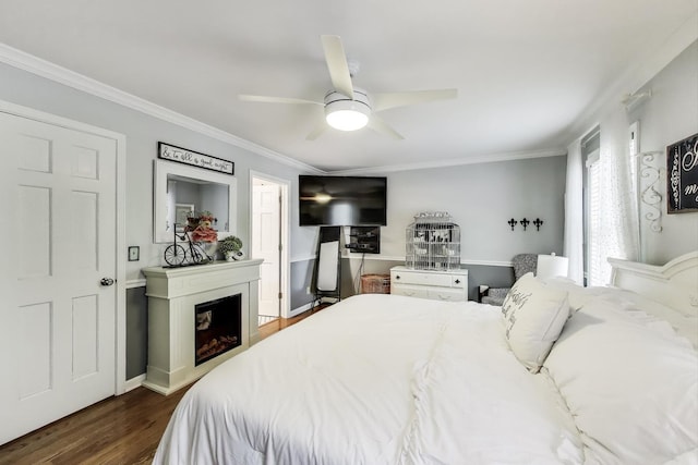 346 Colonial Cir, Geneva, IL 60134 - bedroom with dark wood-style flooring, crown molding, a fireplace, and a ceiling fan