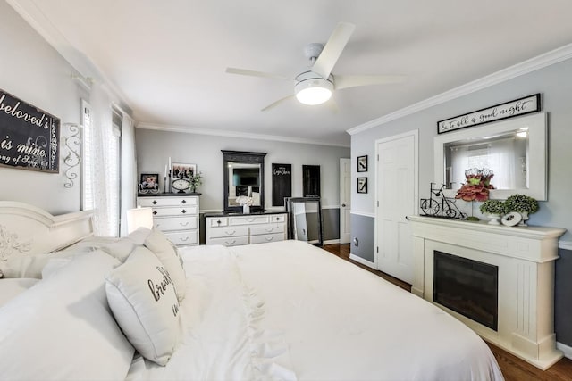 346 Colonial Cir, Geneva, IL 60134 - bedroom featuring crown molding, dark wood-style floors, a glass covered fireplace, and a ceiling fan