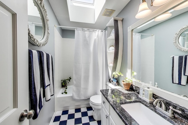 346 Colonial Cir, Geneva, IL 60134 - bathroom featuring tile patterned floors, shower / bath combination with curtain, a skylight, and vanity