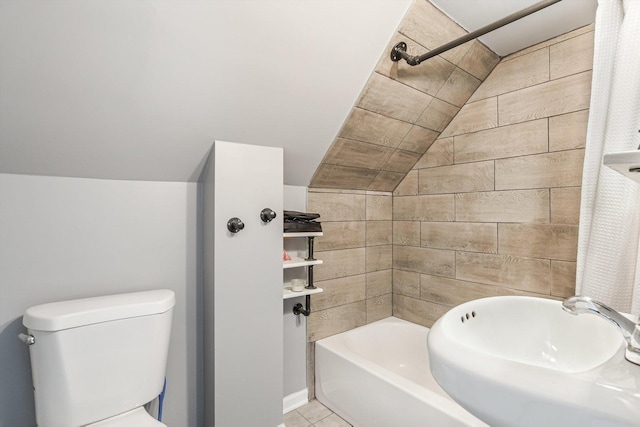 2630 S Spaulding Ave, Chicago, IL 60623 - bathroom with lofted ceiling, shower / bath combination, and tile patterned flooring