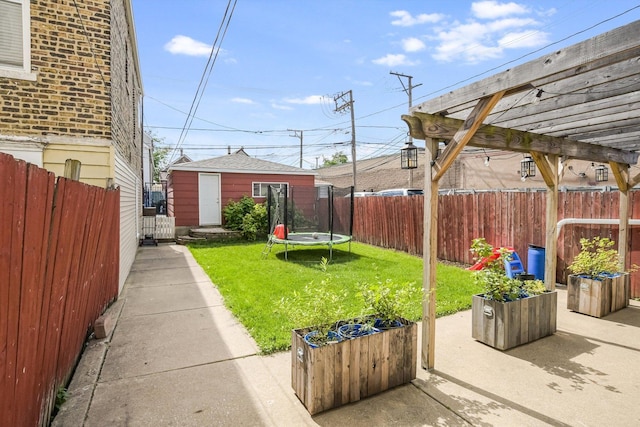 2630 S Spaulding Ave, Chicago, IL 60623 - fenced backyard with a trampoline, a pergola, and a patio