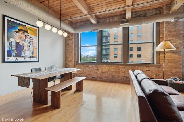 913 W Van Buren St Unit 4C, Chicago, IL 60607 - dining space with brick wall, a wooden ceiling with exposed beams, and wood finished floors