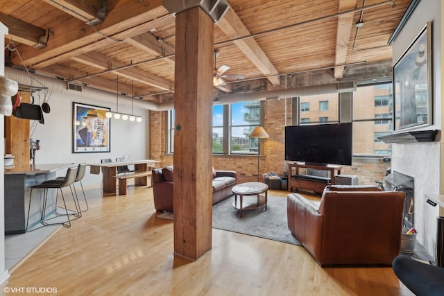 913 W Van Buren St Unit 4C, Chicago, IL 60607 - living area featuring a wooden ceiling with exposed beams, wood finished floors, and ceiling fan
