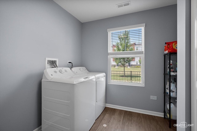 875 Finley Dr, Aurora, IL 60504 - laundry area featuring separate washer and dryer and wood finished floors