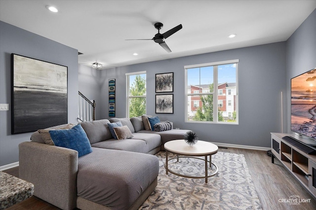 875 Finley Dr, Aurora, IL 60504 - living area featuring stairs, wood finished floors, ceiling fan, and recessed lighting