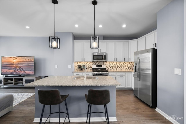 875 Finley Dr, Aurora, IL 60504 - kitchen featuring stainless steel appliances, tasteful backsplash, white cabinets, and recessed lighting