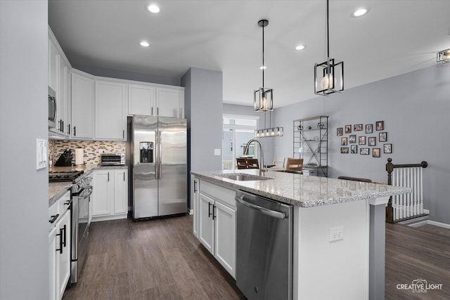 875 Finley Dr, Aurora, IL 60504 - kitchen with stainless steel appliances, dark wood finished floors, white cabinetry, recessed lighting, and backsplash