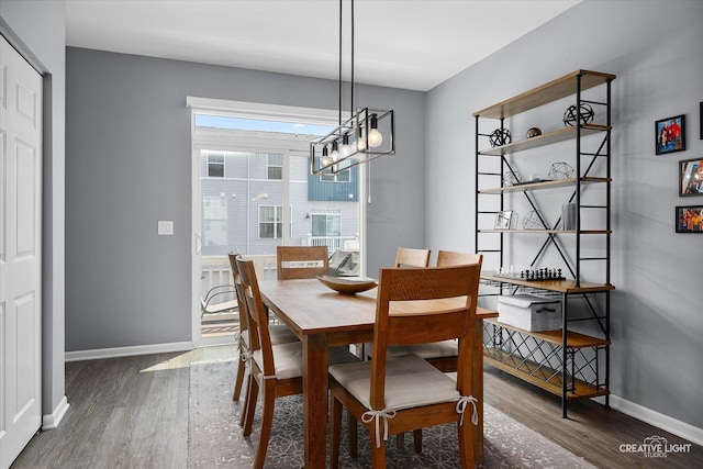875 Finley Dr, Aurora, IL 60504 - dining area featuring wood finished floors and a chandelier